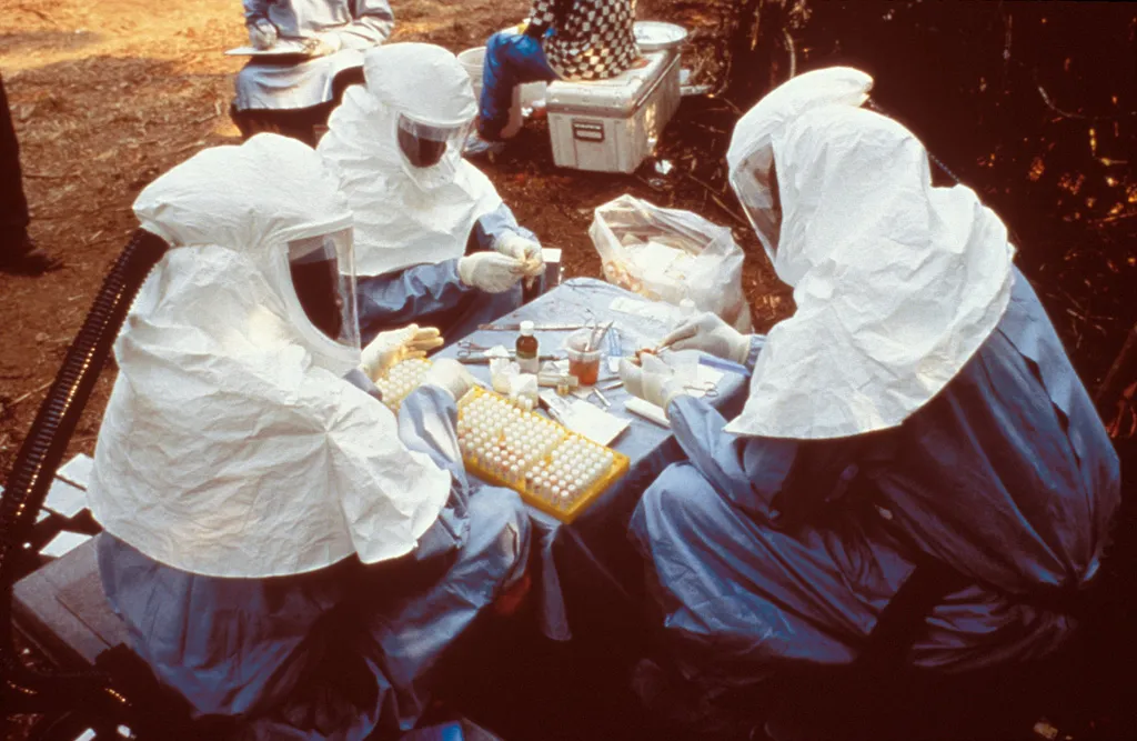 Scientists wearing protective equipment in an unrelated 1995 Ebola outbreak in Zaire; archival, not the 2026 DR Congo outbreak.