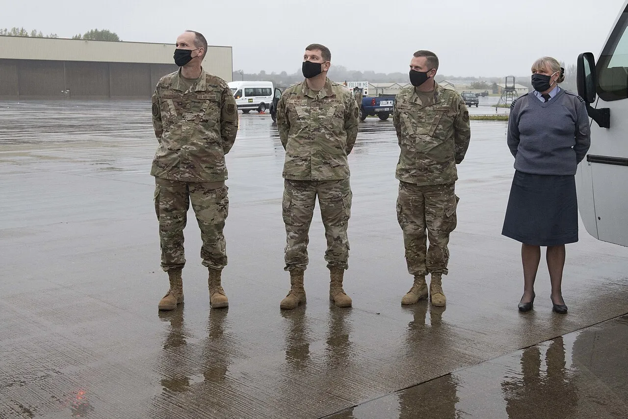 US Air Force personnel and a visitor at RAF Fairford during an unrelated 2020 visit; no people pictured are linked to the 2026 investigation.